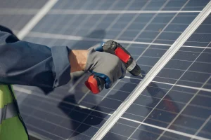 1-man-with-white-helmet-near-solar-panel -